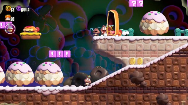 1699911375 547 Top 5 des gimmicks Wonder Flower Power dans Super Mario Une capture d’écran de Super Mario Bros. Wonder de Daisy en tant que Goomba, tandis qu’une Gueule d’Antre mange un Goomba endormi sur une plate-forme plus élevée.